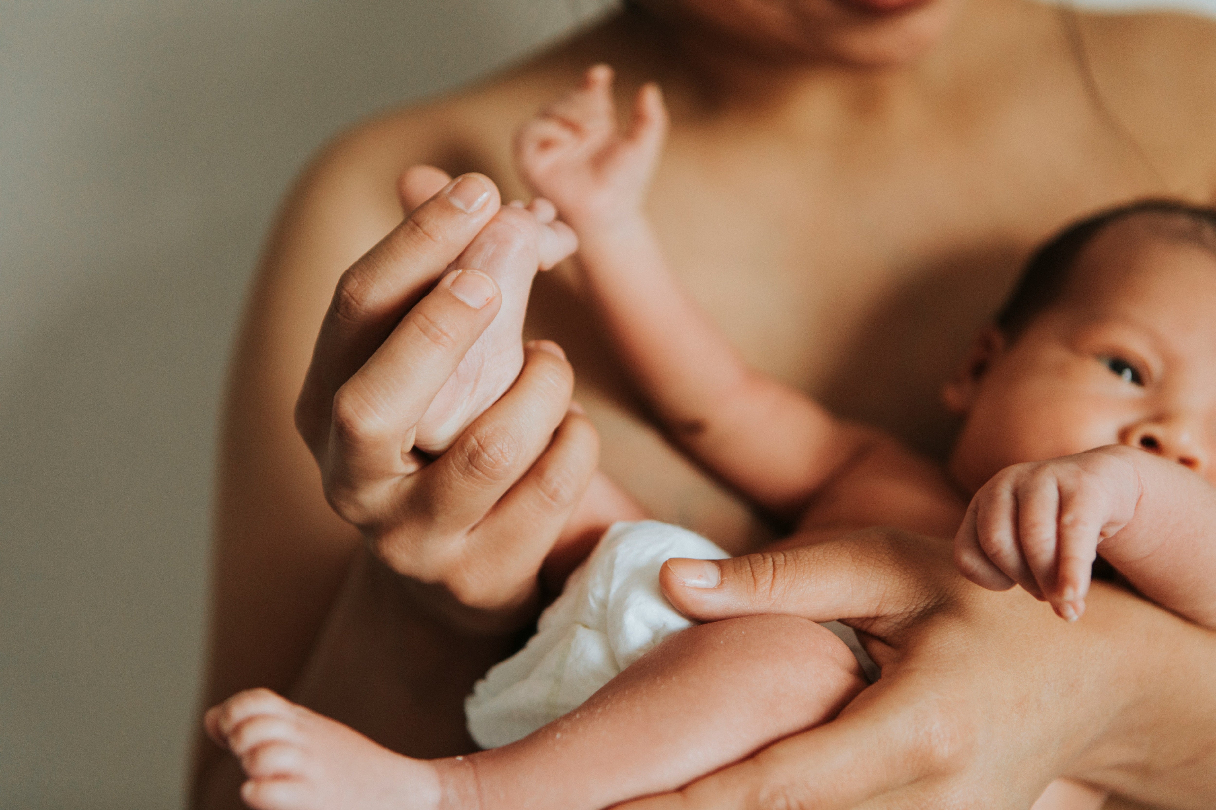 Mother holding newborn